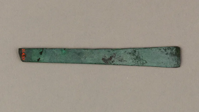 A small copper model chisel, about 4,700 years old, from the tomb of King Khasekhemui at Abydos. Metropolitan Museum of Art.