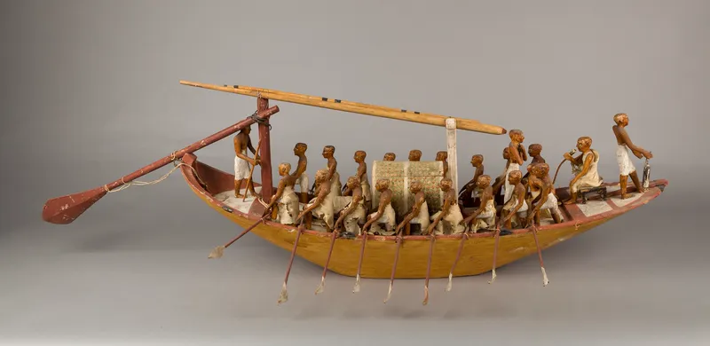A model of a traveling boat and its rowers from the tomb of Meketre, about 4,000 years old. Metropolitan Museum of Art, New York.
