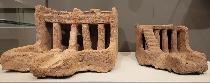 Two clay soul houses from Deir Rifa, with columned porches. Museum of Fine Arts, Boston.