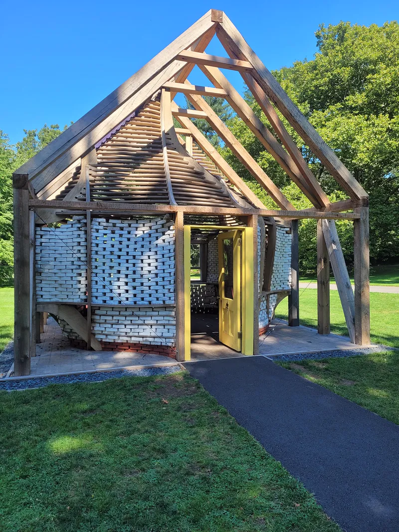 A small house built from mycelium bricks, shown at the New York Botanical Garden in 2024.