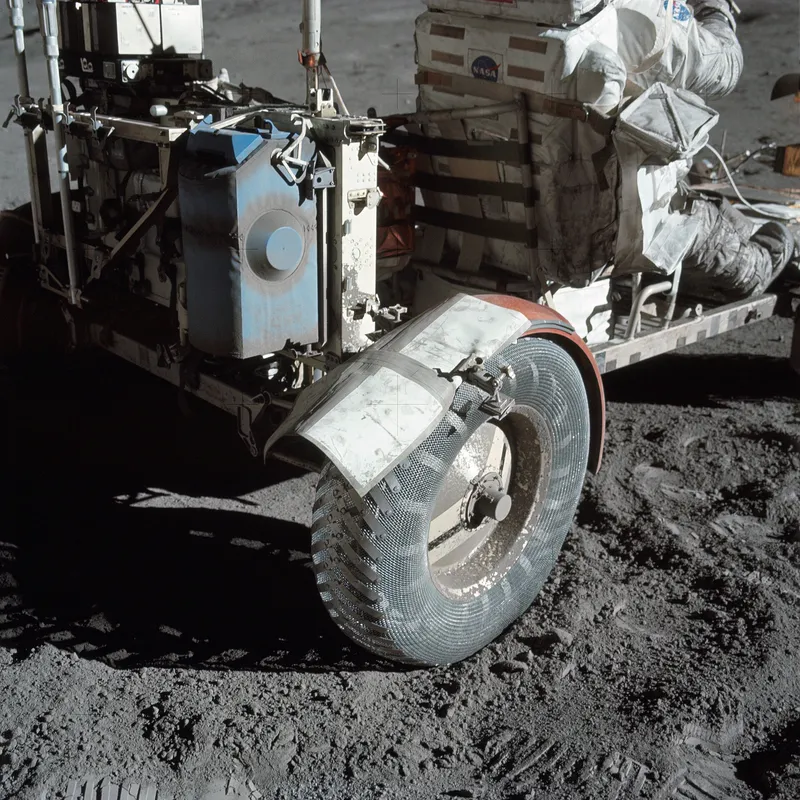The Apollo 17 rover's fender repaired with maps and tape after it broke, to stop dust spraying the crew.