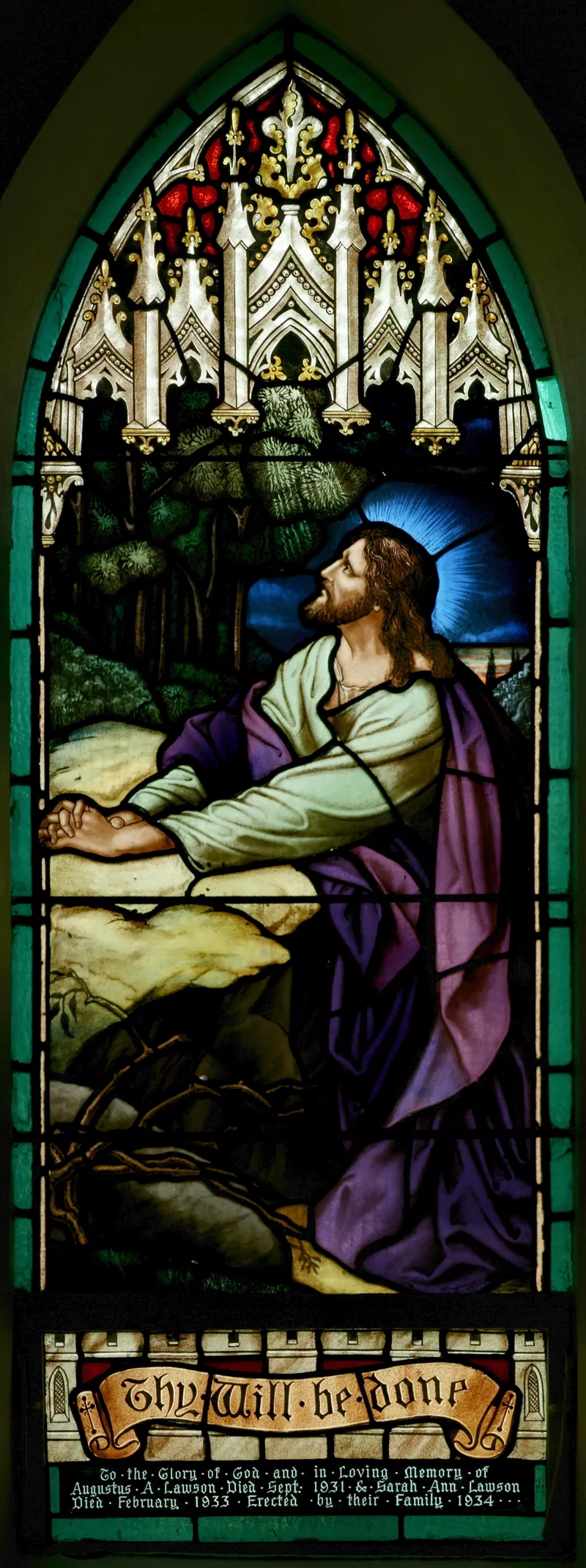 Jesus praying in the garden of Gethsemane, in a stained-glass window at St John's Church, Ashfield, in Sydney, Australia.