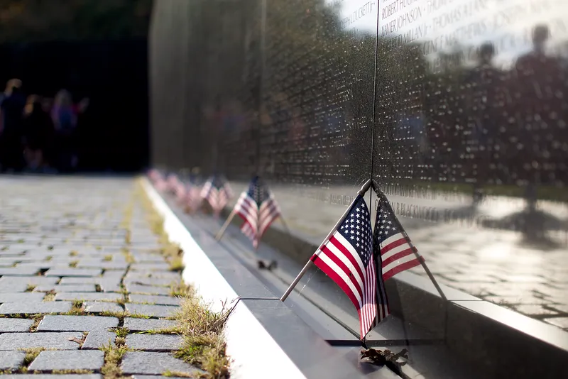 Flags left at the Vietnam Veterans Memorial wall in Washington, DC.