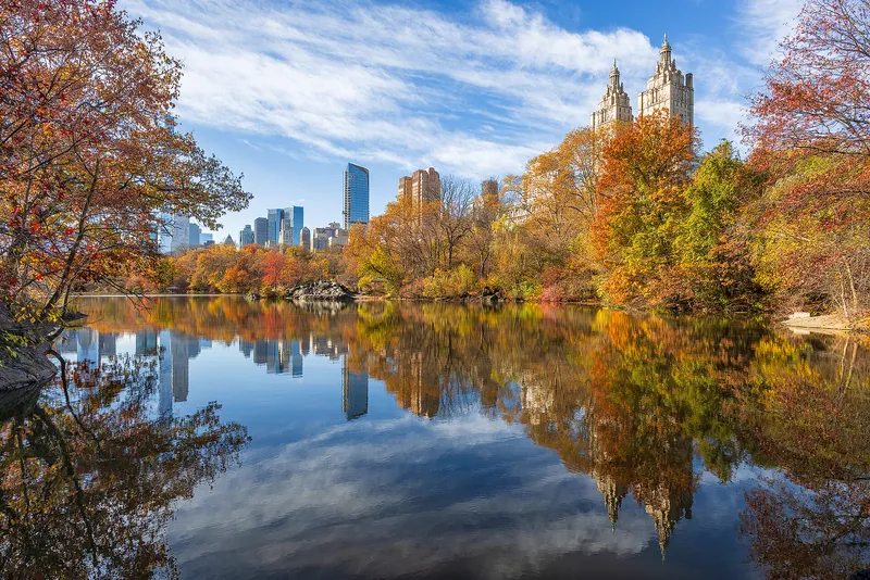 The Lake in Central Park, New York, with the city skyline beyond.