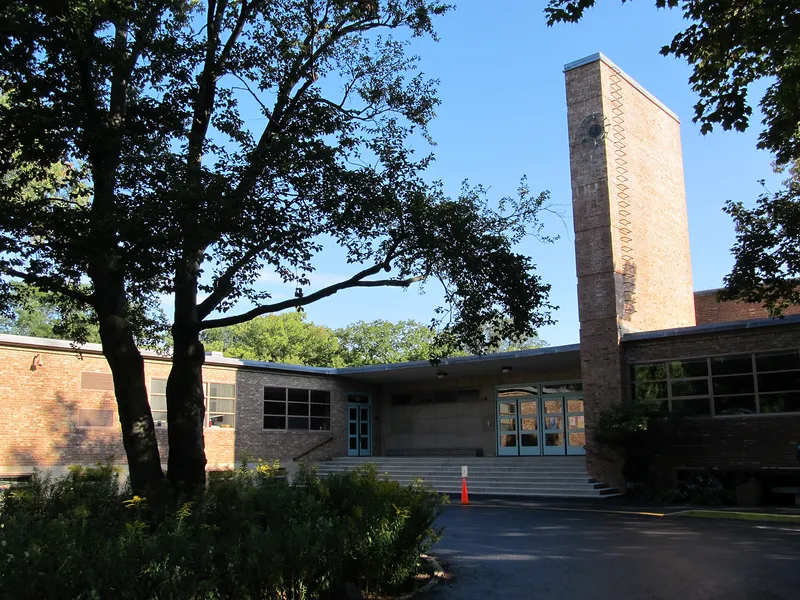 Crow Island School in Illinois (1940), designed around children, with low windows and classrooms opening onto gardens.