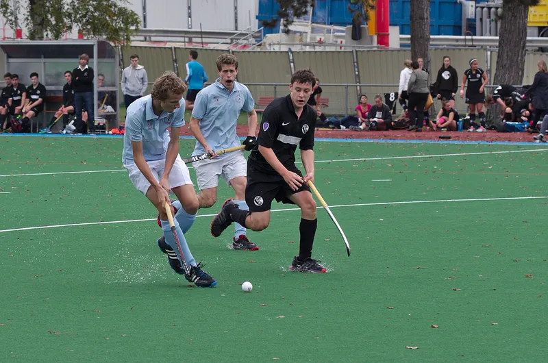 Field hockey on an artificial turf field.
