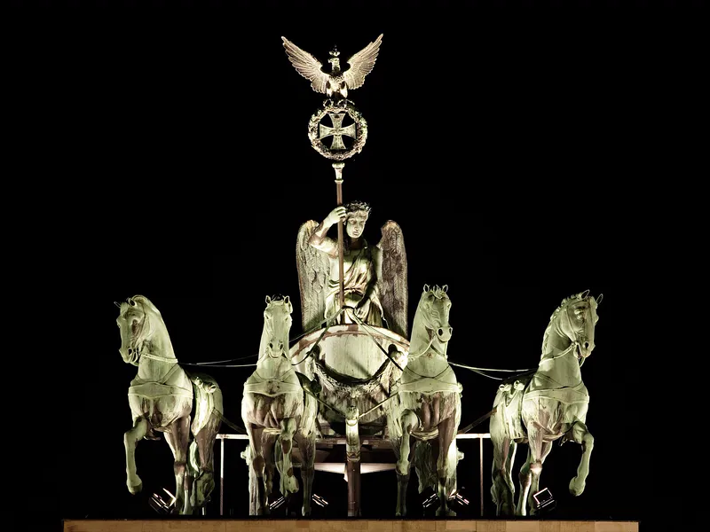 The quadriga, a chariot pulled by four horses, on top of the Brandenburg Gate in Berlin (a much later statue in the Roman style).