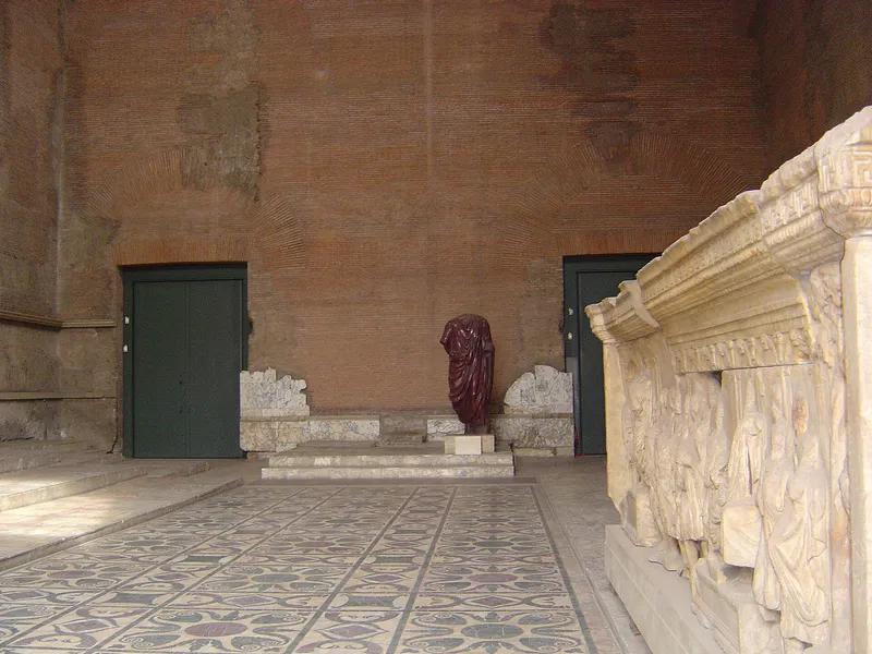 Inside the Curia Julia, with its marble floor and the low steps where senators sat.