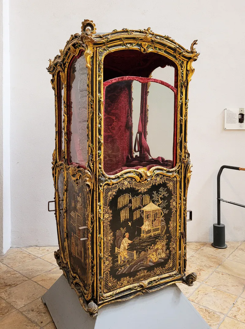 A decorated sedan chair, a later relative of the Roman litter, in Amalfi, Italy.
