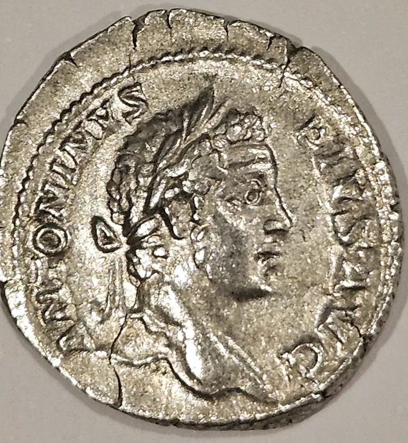 A silver denarius showing the emperor Caracalla.